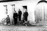 Father Edward Dondanville 
in front of the birth place of his father in St. Maurice with Alphonse Dontenville, 
his daughter Odiel and three sons during visit in 1910.