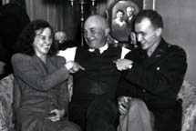 Vern Dondanville with his children, Helen Celeste 
( Miki ) , and Wilfred Lavern  (Bill)  , picture of Dan and Mary Ellen in background, Ottawa, circa 1948.